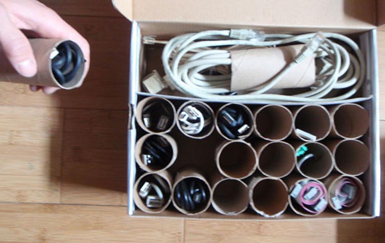 Use Empty Toilet Rolls To Organize Your Cable Box
