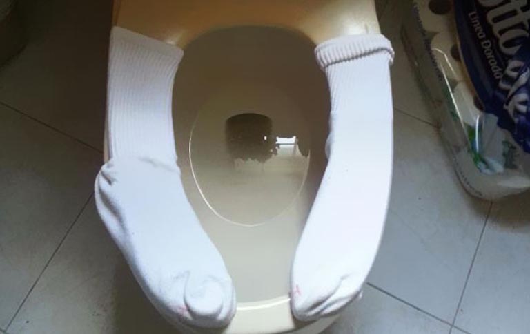 Use A Pair Of Socks On A Cold Toilet Seat