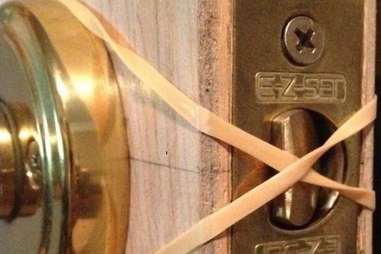 Use A Rubber Band To Keep Your Door From Latching (And Trapping You Outside)