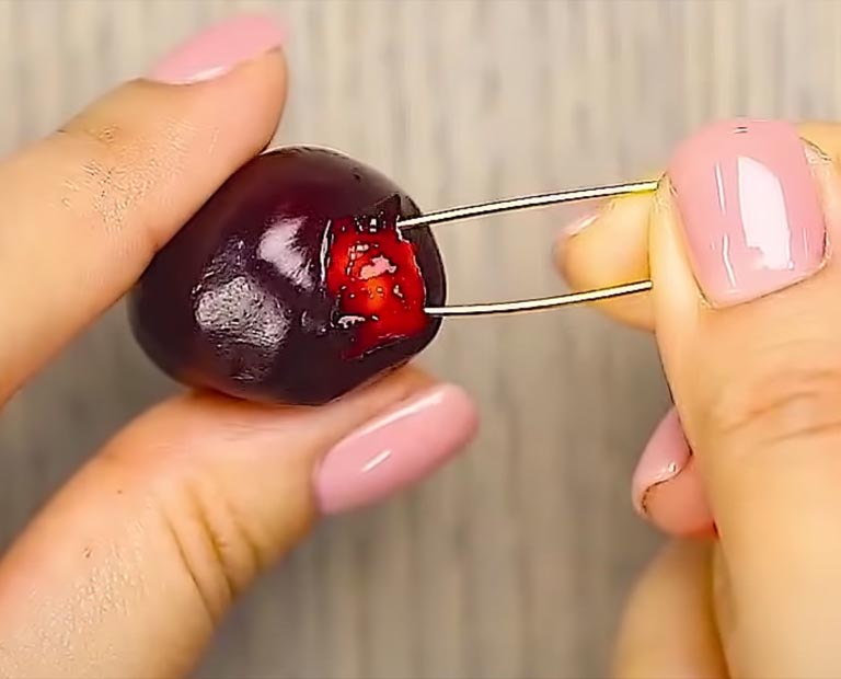 Quickly And Efficiently Pit A Cherry Using A Safety Pin